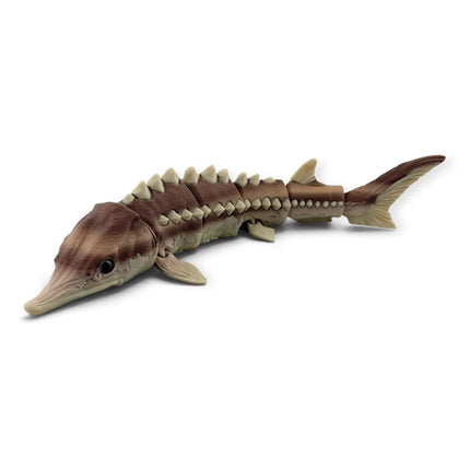 Articulated Brown Sturgeon figurine flexing to show movement