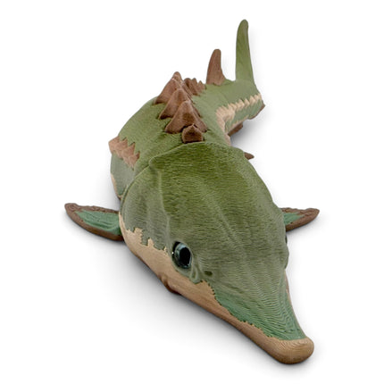 Close-up of Green Camo Sturgeon armored plating and glass eye detail