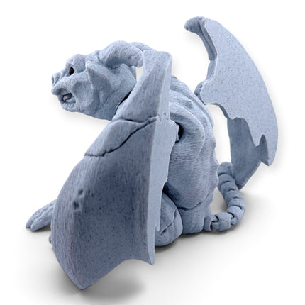 Gargoyle figurine displayed on desk as gothic decor