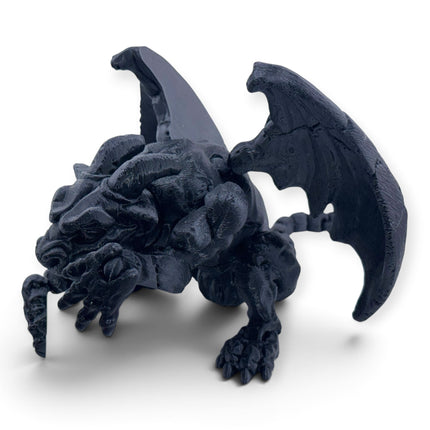 Gargoyle figurine back view showing wing detail