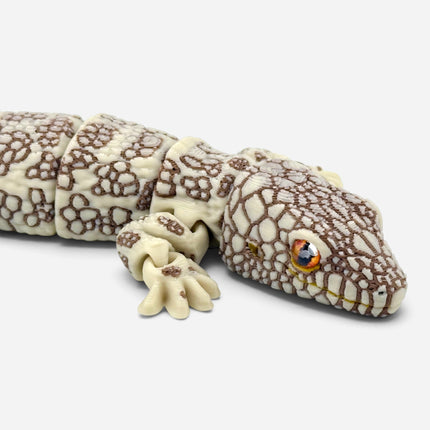 Close-up of Western Chameleon Gecko figurine glass eye detail