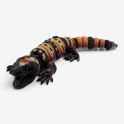 Close-up of Gila Monster figurine glass eye detail