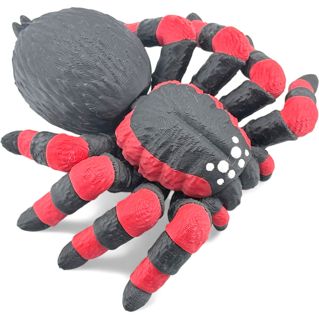 Tarantula figurine side profile with white spots detail
