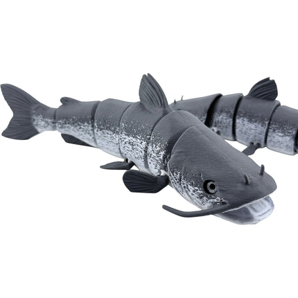 Tidal 3D Printed articulated catfish toy with a grey mottled finish and detailed whiskers on a white background